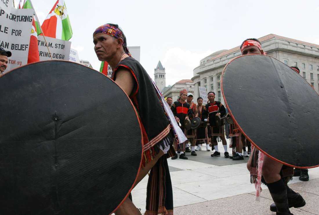In this file 21 June 2005 photo, Montagnards perform in Freedom Plaza in Washington DC during a protest against alleged human rights abuses committed against them by the Vietnamese government. Security forces in Vietnam's Central Highlands are battling a small group of insurgents, said to be Montagnards, who authorities say attacked police stations on June 11