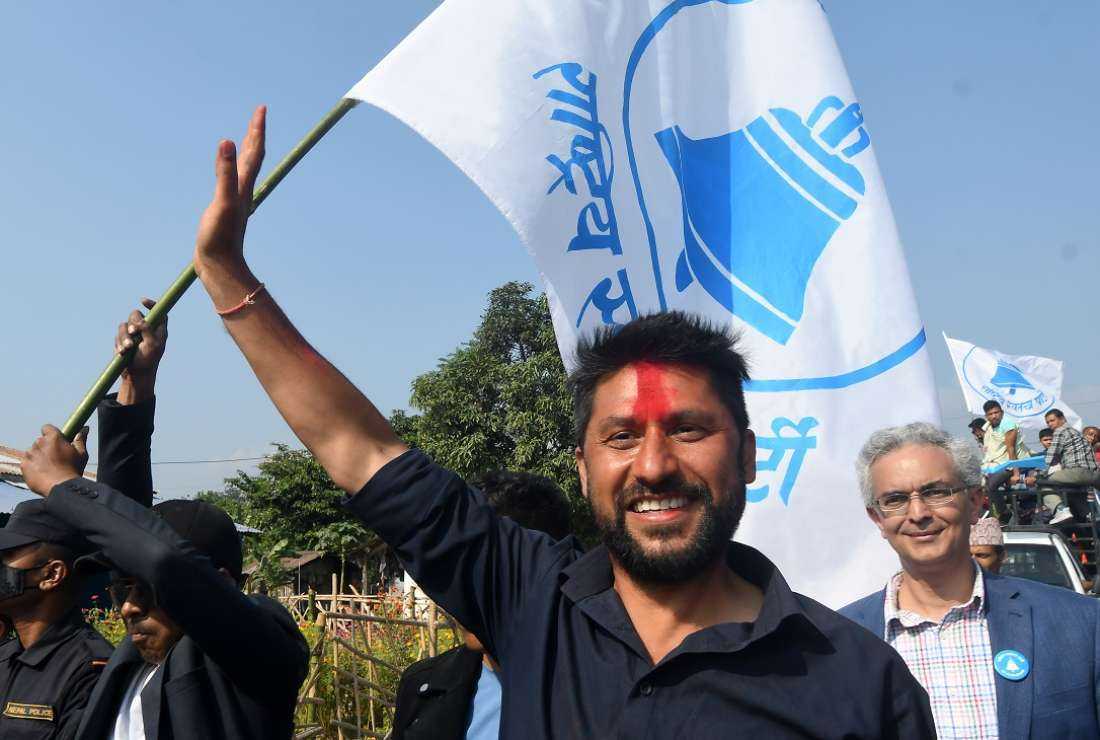 Former television host and Rastriya Swatantra Party candidate Rabi Lamichhane waves during an election campaign event in Padampur, on Nov. 12