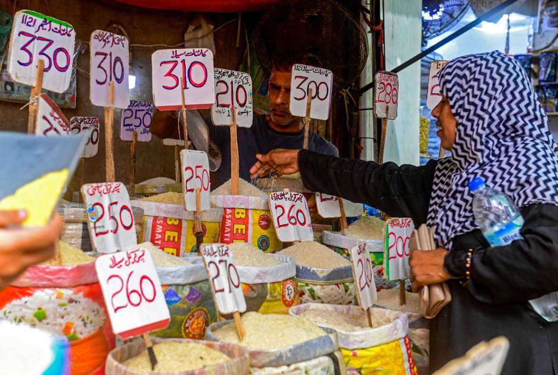 A customer buys rice at a wholesale shop in Karachi on June 8, 2023. (Photo: AFP)