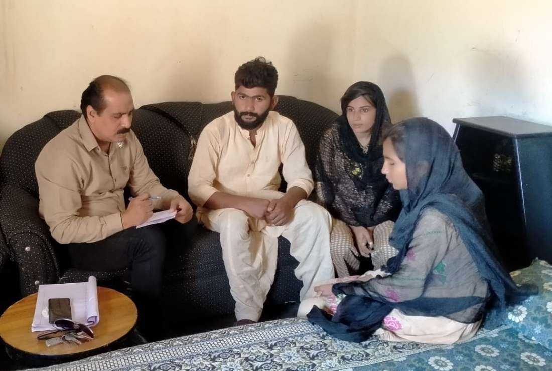Daughters of Musarrat Bibi who was unusually granted bail less than a month after being arrested under Pakistan's controversial blasphemy law, speak to the media at their home in Punjab province