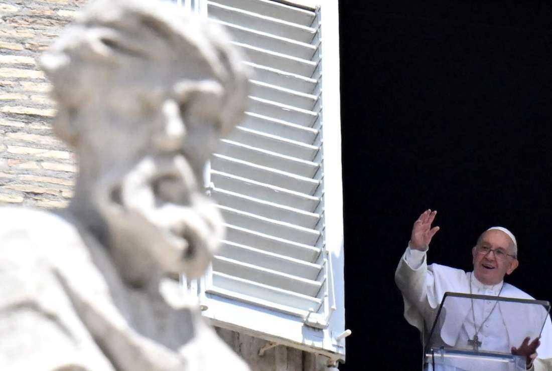 Pope Francis salutes the audience during his Angelus prayer from a window of the apostolic palace overlooking St. Peter's Square at the Vatican on June 26